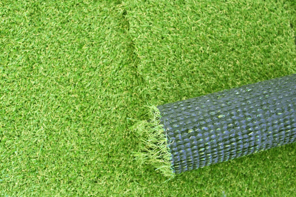 Artificial green grass laying background for your design
